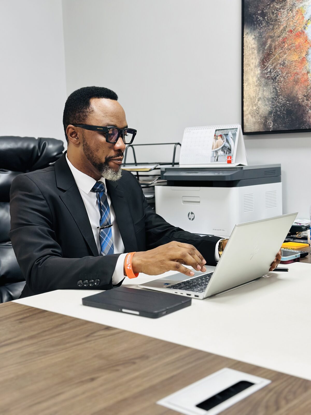 Samuel Ato Afful focused on his laptop