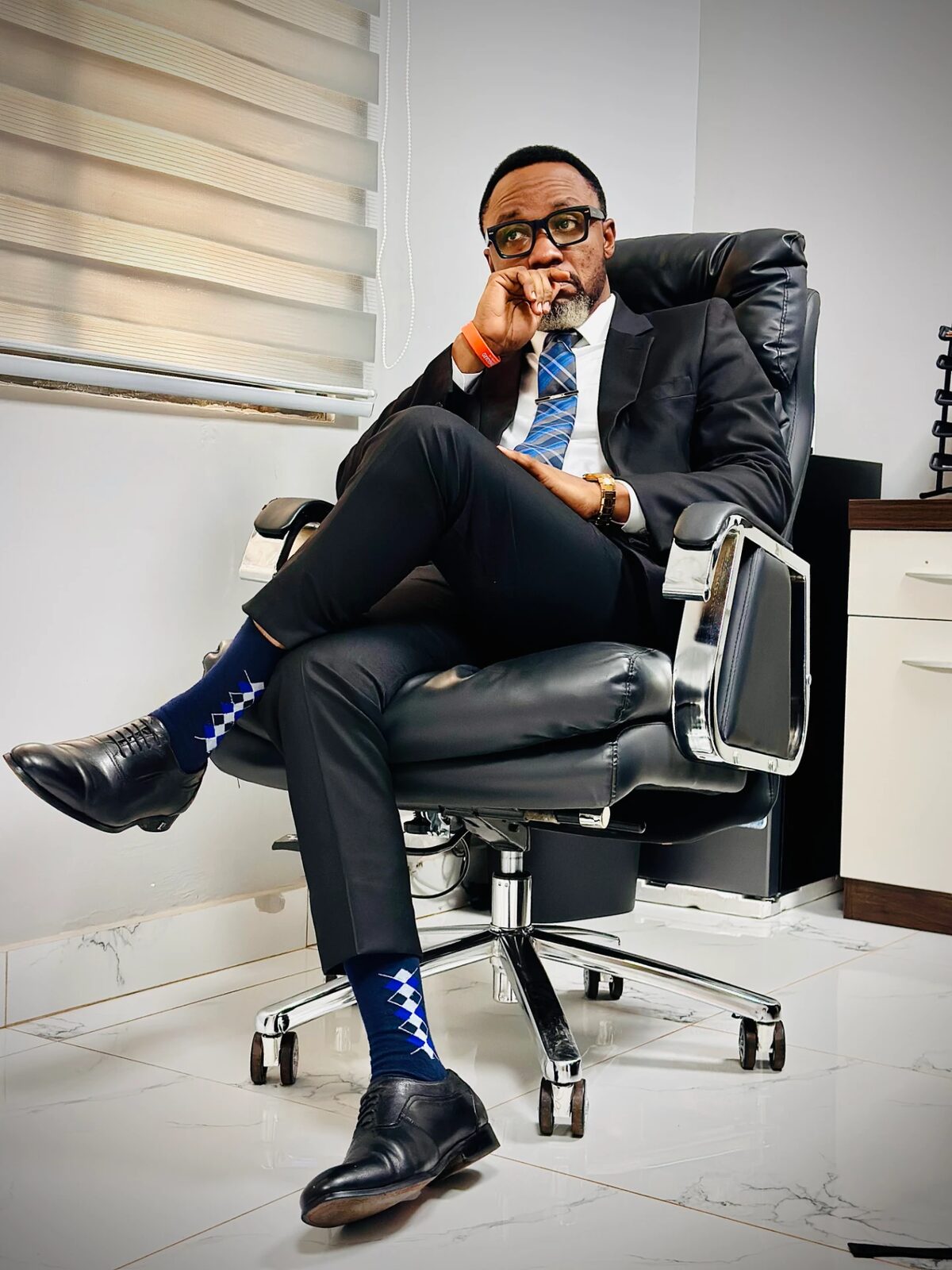 Samuel Ato Afful seated in thought in his office