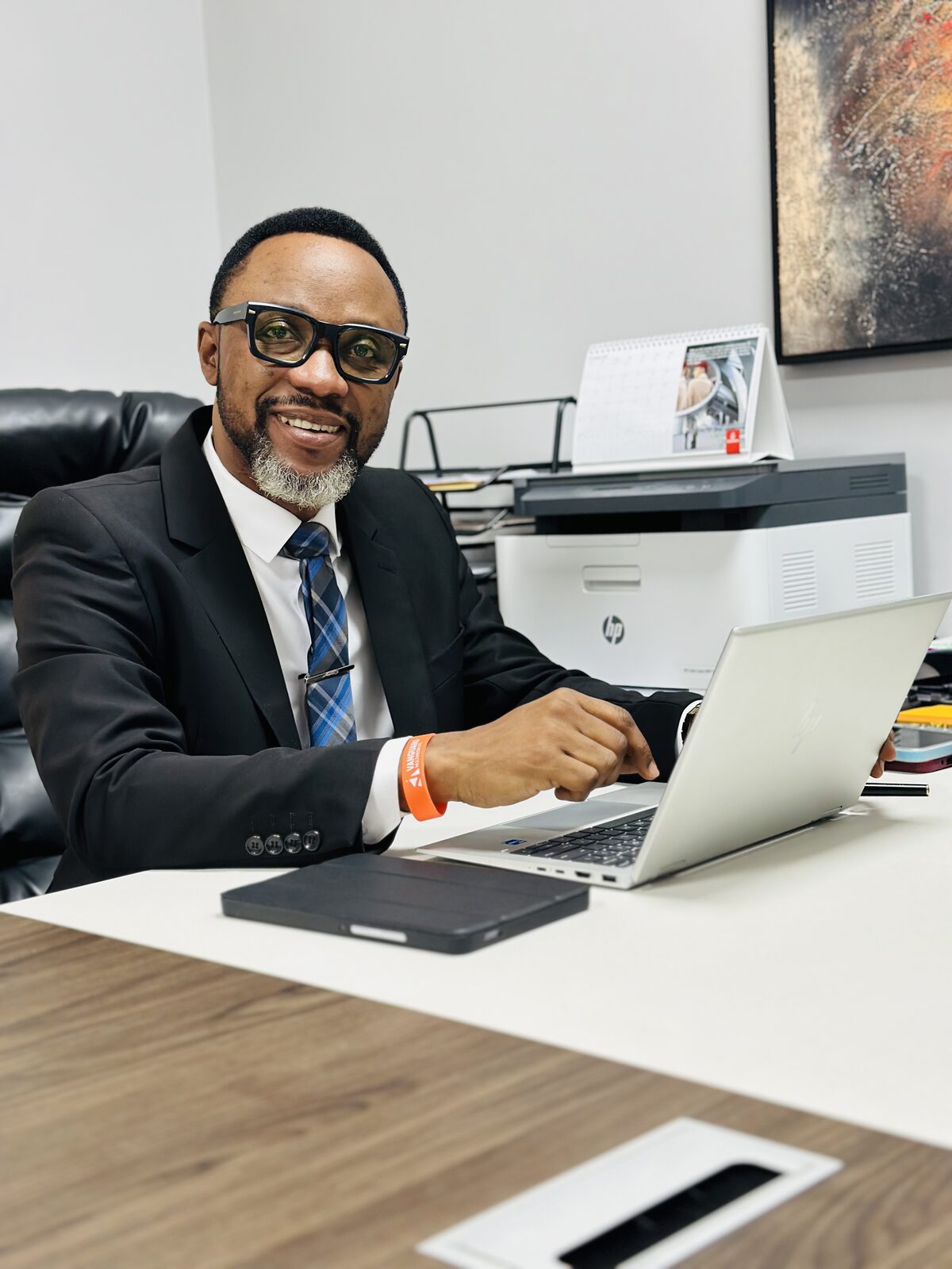 Samuel Ato Afful smiling in the office
