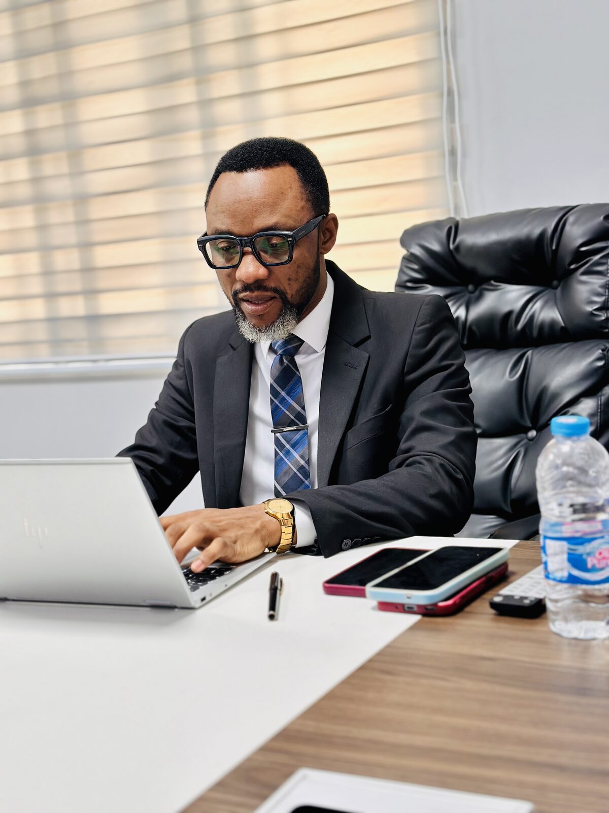 Samuel Ato Afful at work at his desk
