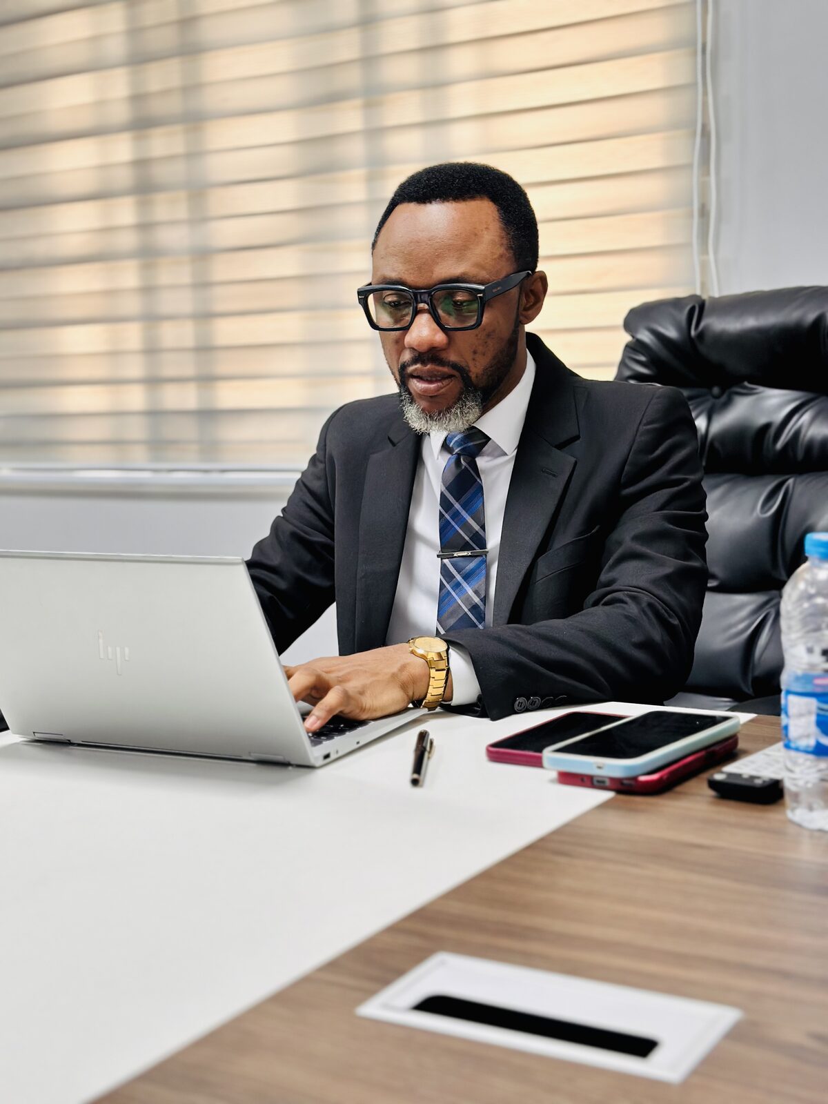 Samuel Ato Afful typing at his desk