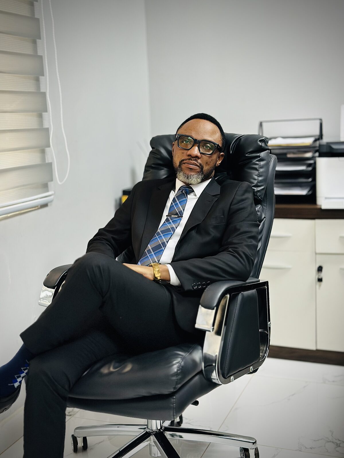 Samuel Ato Afful seated in an office chair